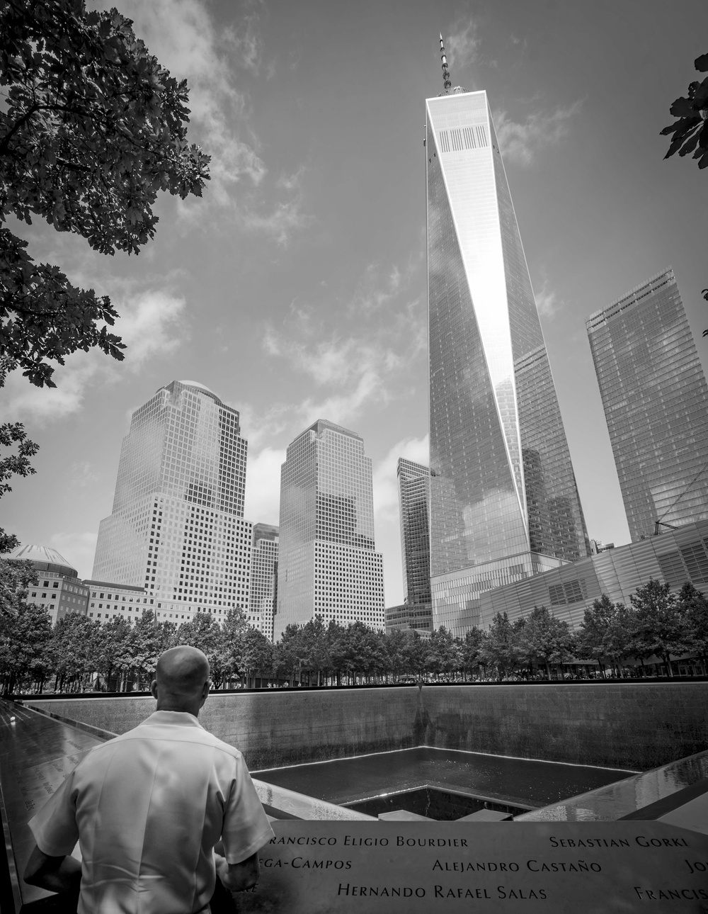 Visitor paying respects at the National September 11 Memorial in New York City